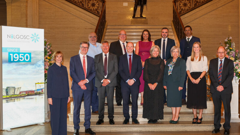 Group picture of Minister Gordon Lyons with members of NILGOSC's Management Committee and Senior Management Team.